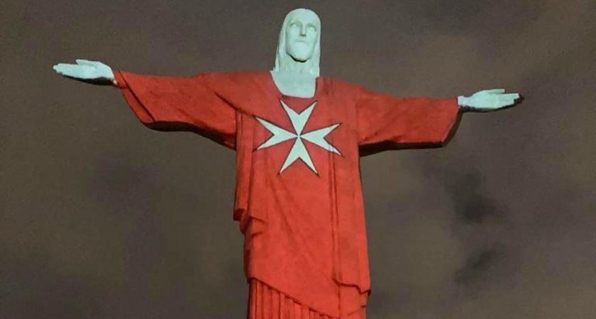 Christ the Redeemer in Rio de Janeiro illuminated with the flag of the Order of Malta